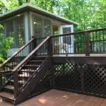 A deck with stairs leading to the porch.