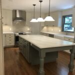 A Grey and White Color Kitchen Island Space