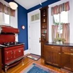 Blue Wall, White Door and Brown Cabinets